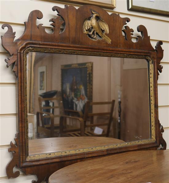 A walnut fret frame wall mirror, H.68cm